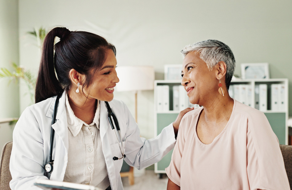 Doctor comforting patient during consultation