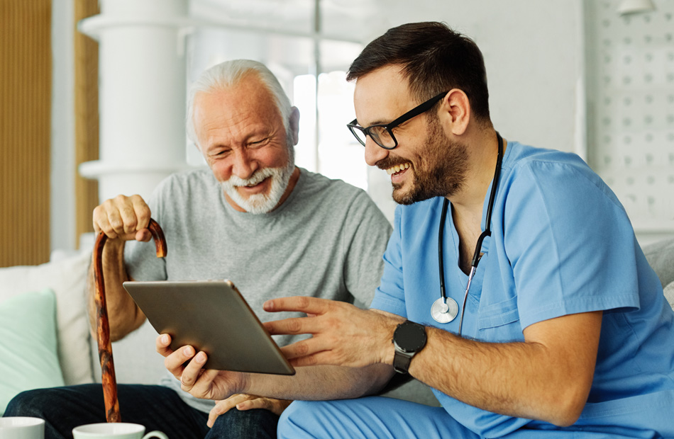 Healthcare professional reviewing information with older patient