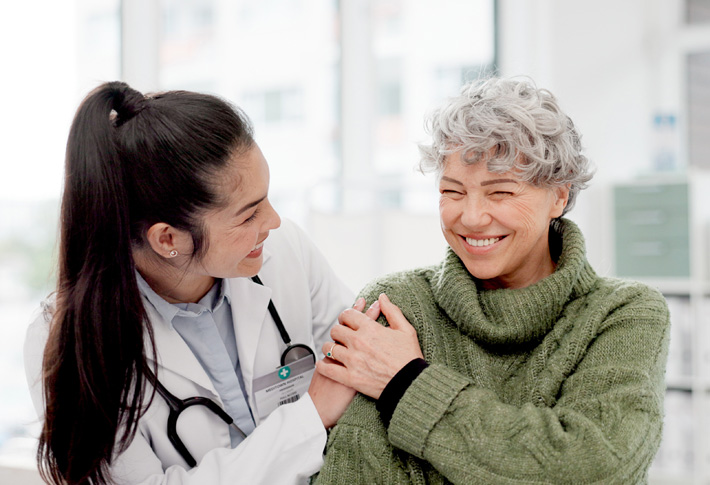 Clinician administering vaccine to patient