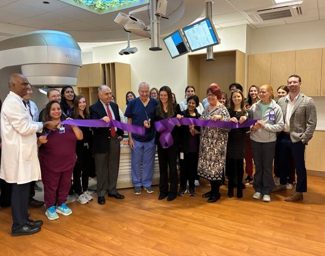 Hospital staff celebrating ribbon-cutting ceremony