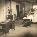 Radiologic technologist assisting a patient in X-ray room